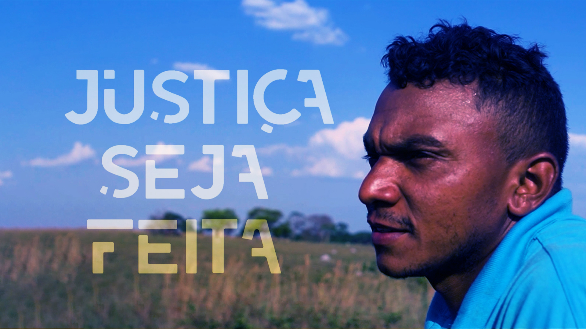 Imagem mostra o perfil de um homem negro ao fundo uma paisagem com mato e o céu azul; tem ainda a frase Justiça seja feita escrita em letra branca