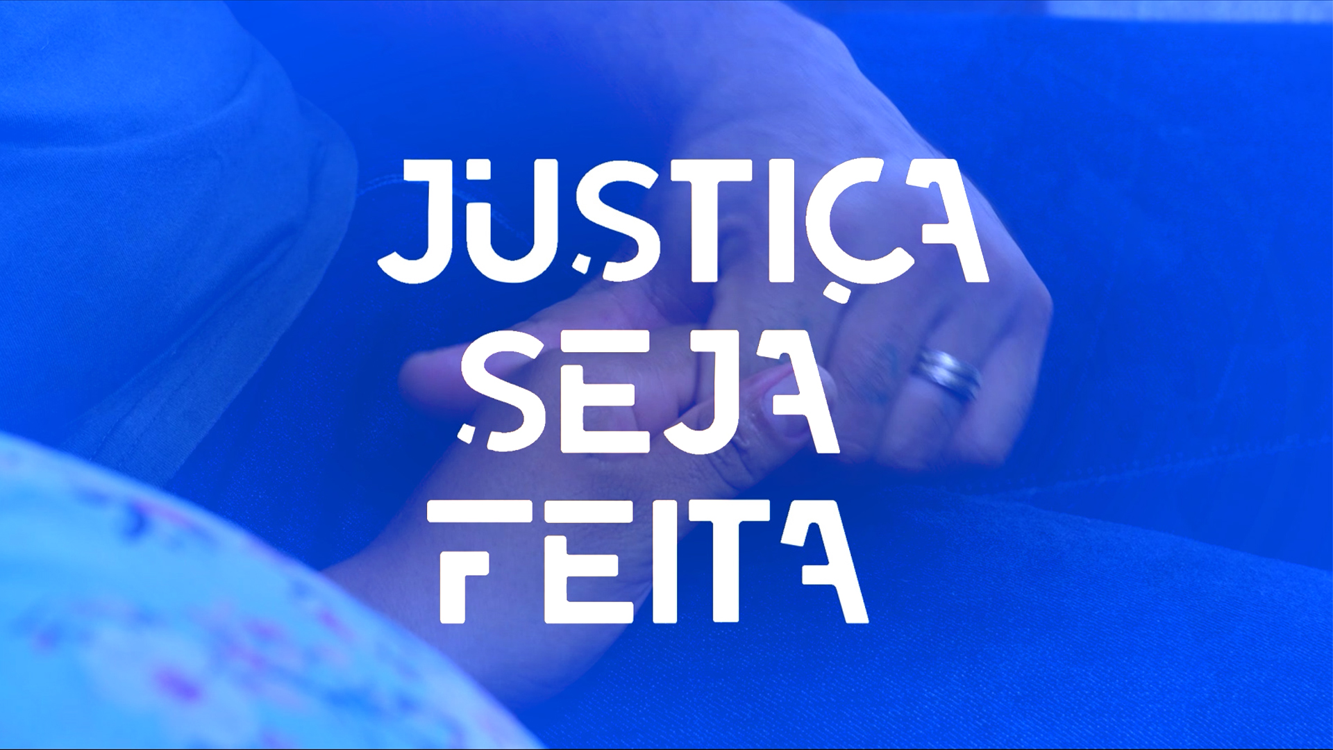 Imagem em tom azul mostra ao fundo duas mãos entrelaçadas; à frente o nome Justiça seja feita